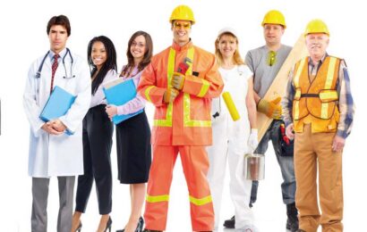 Multiple people standing in a line from different places of work in uniform.